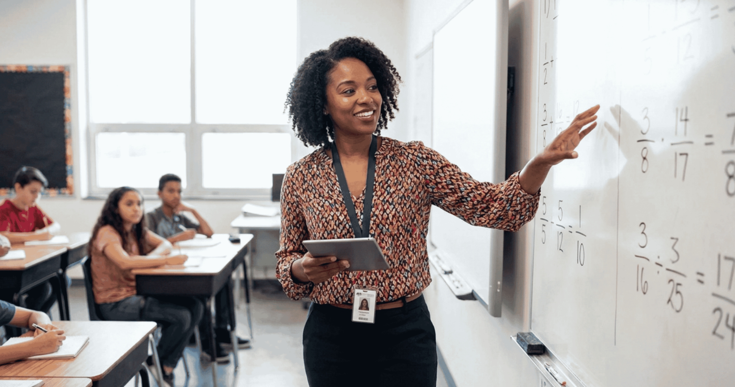 Middle school teacher teaching in front of a class