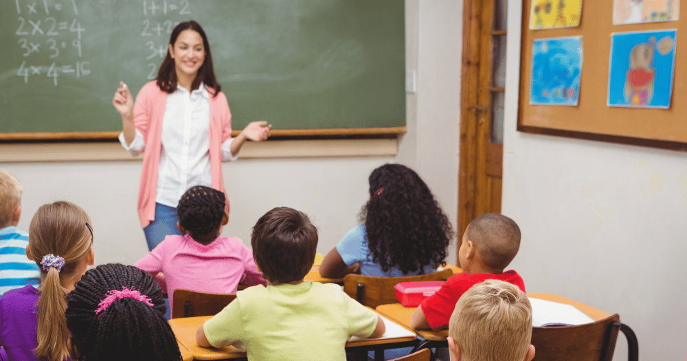 Teacher in front of her class teaching