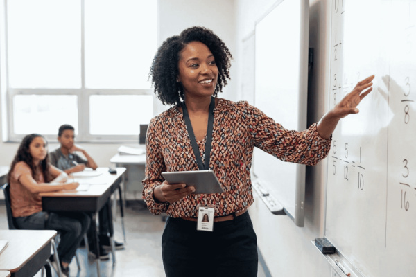 Middle school teacher teaching in front of a class